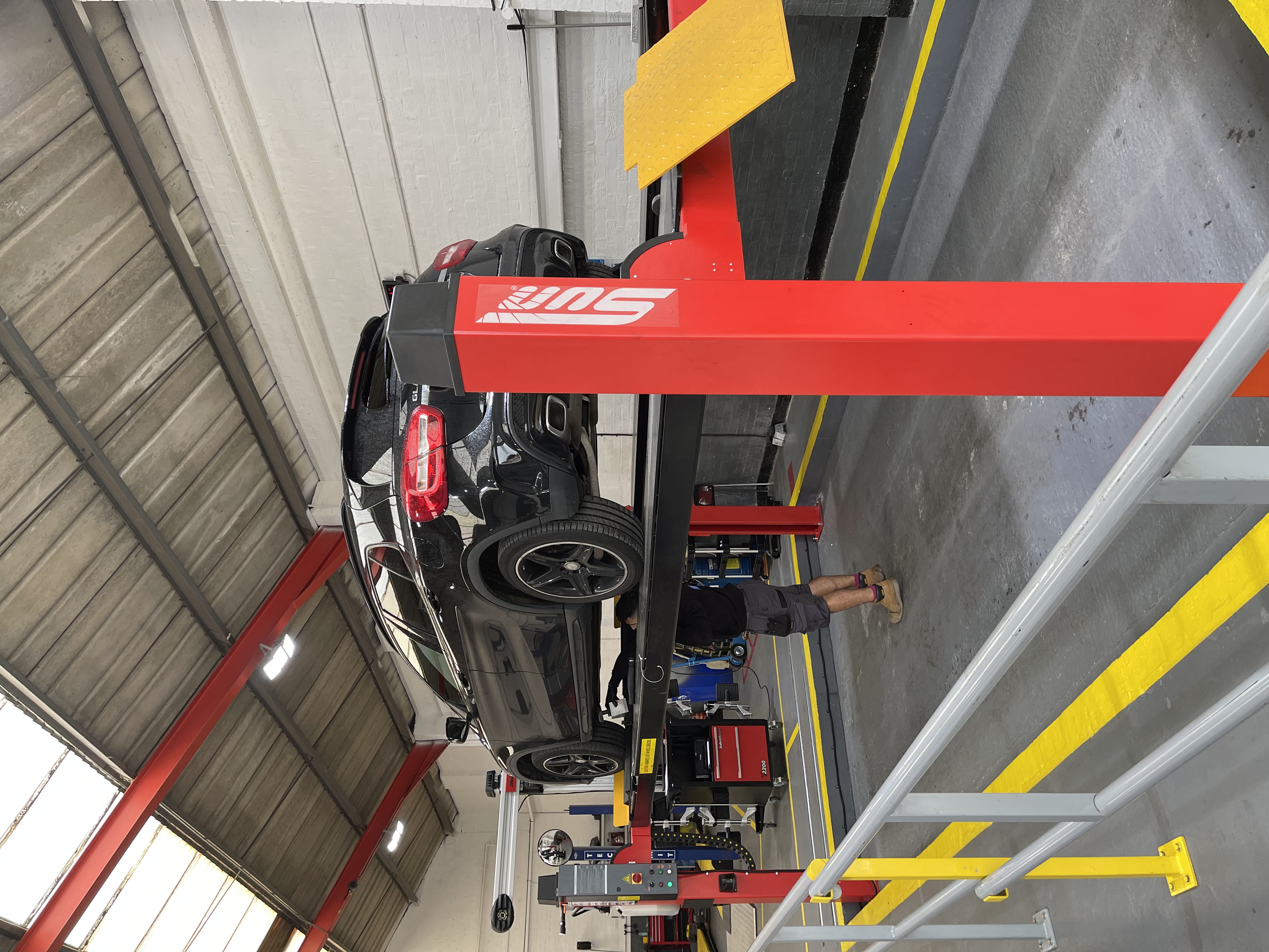 Mercedes on Service Lift at Longton MOT Test Centre in Stoke-on-trent