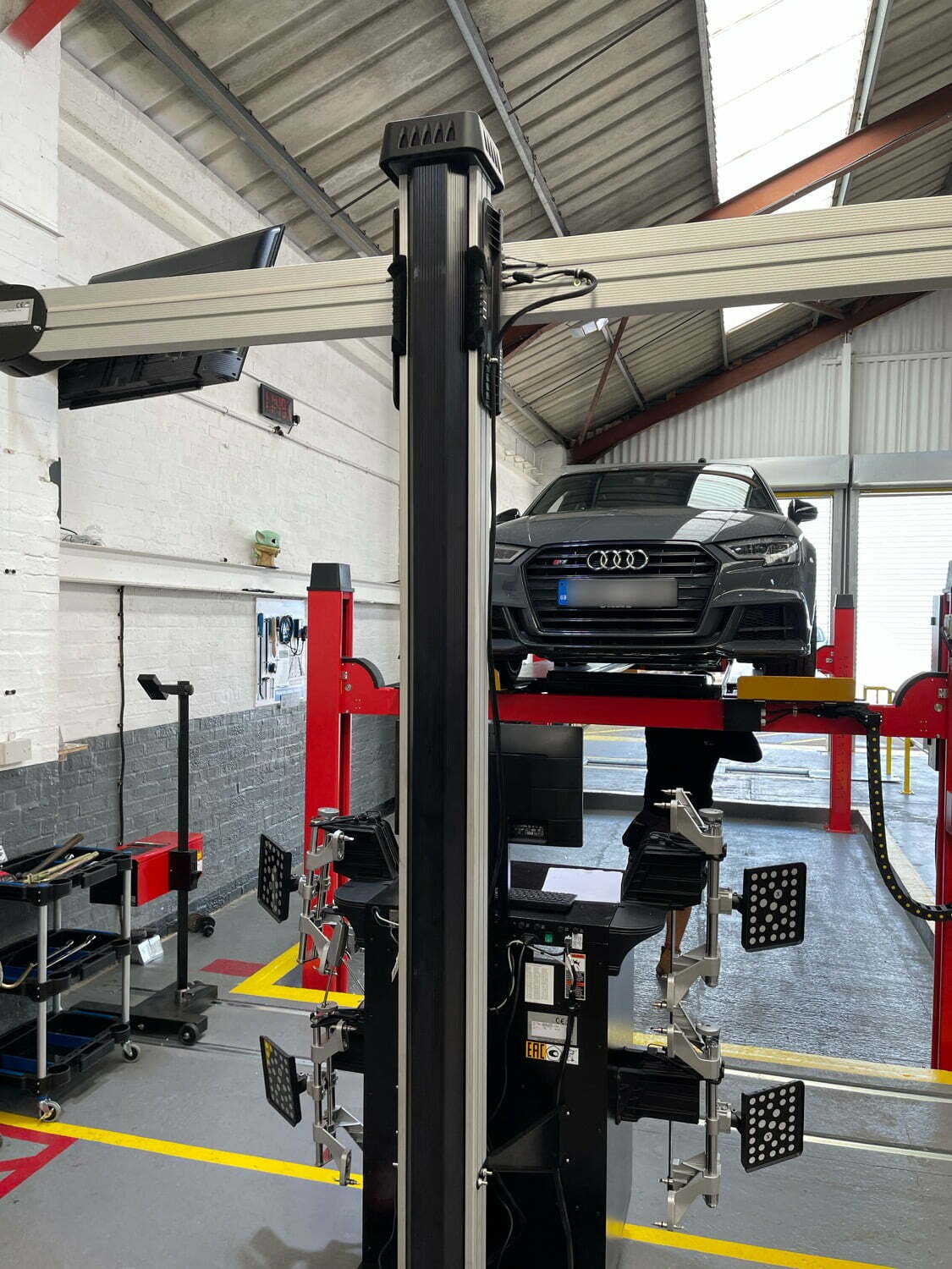 Car Audi on MOT test ramp at Longton MOT Test Garage in Stoke-on-trent